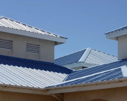 Blue and silver metal roofs on a commercial building