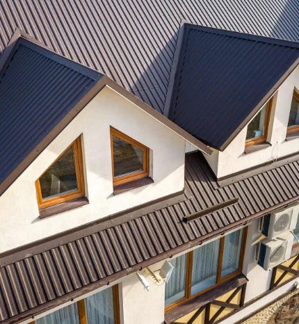 Dark metal roof with dormers