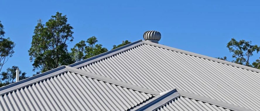 Gray metal roof among trees