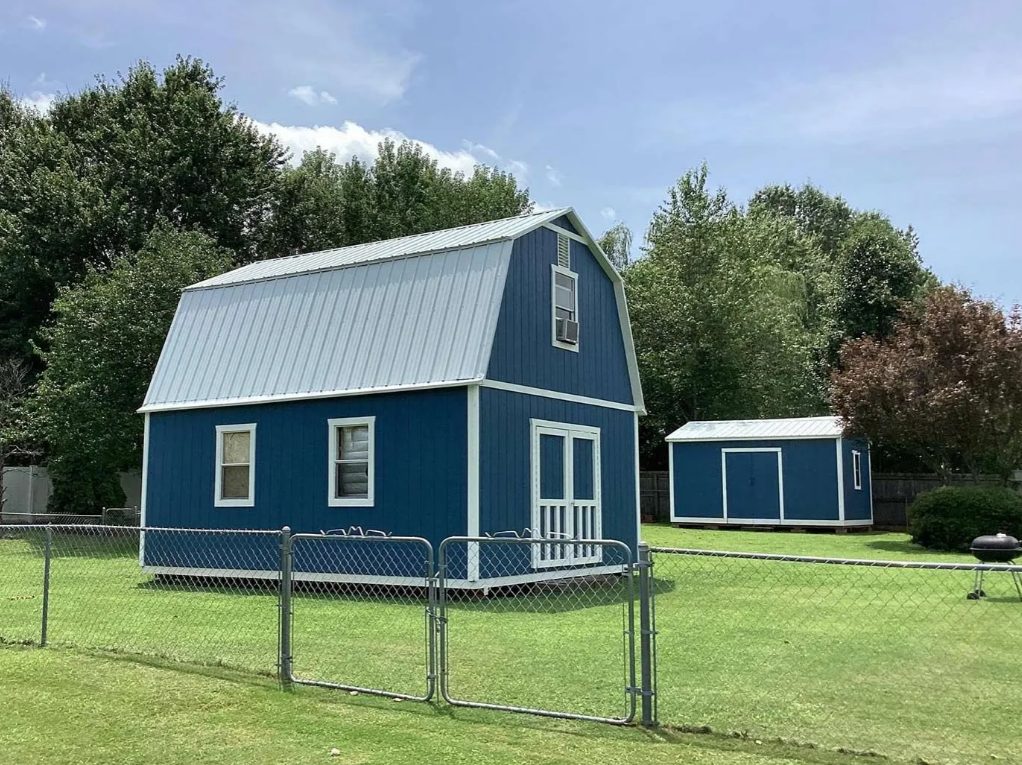 Blue barn with a galvalume roof