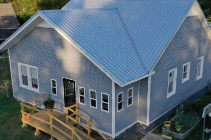 Slate blue metal roof on a sided home