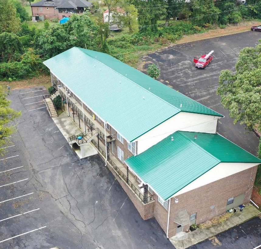 Green metal roof on a commercial building
