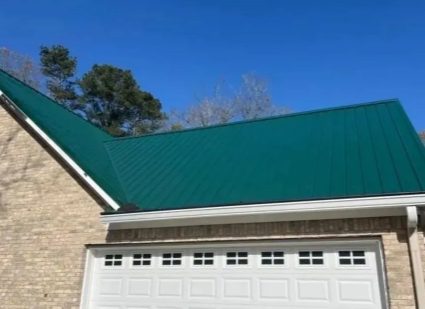 Green metal roof on a garage