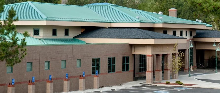 Green metal roof on a large lodge building