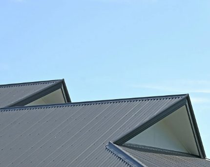 Black metal roof with chimney detail