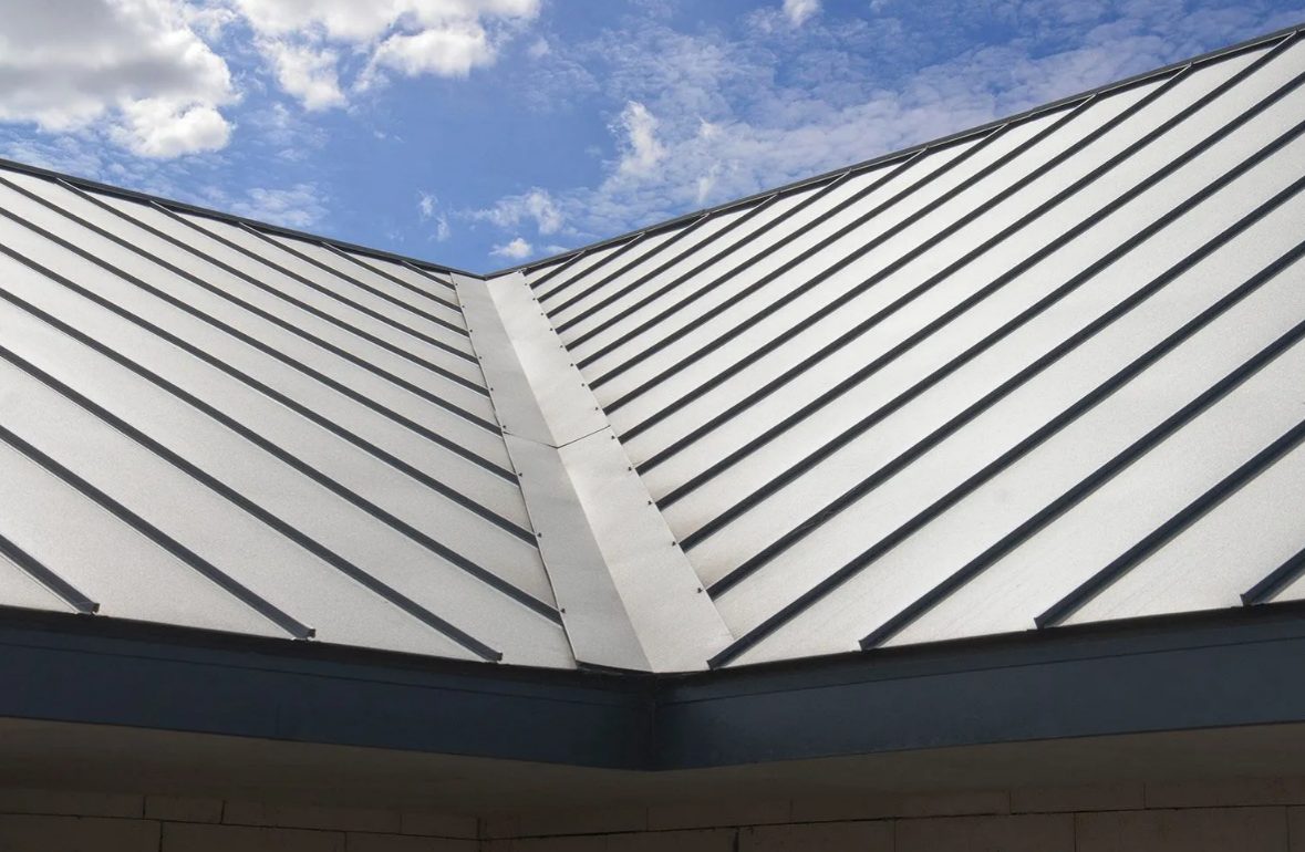 Silver ridge cap and trim on a standing-seam metal roof