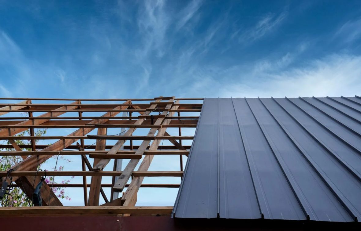 Metal roof under construction with wooden framing